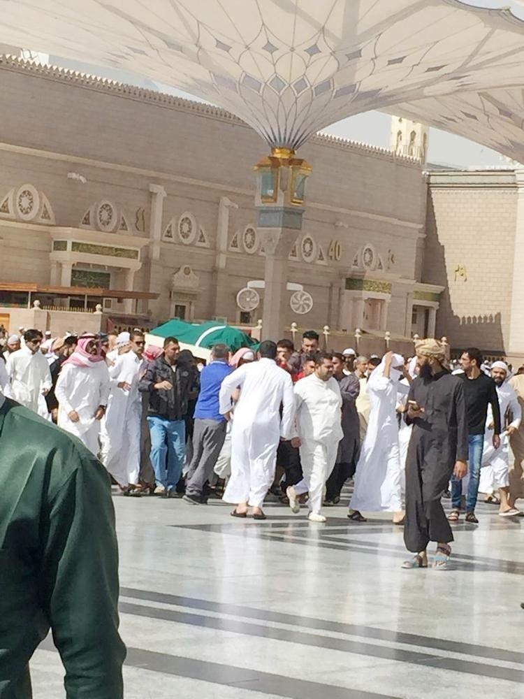 Relatives carry the body of the boy to the cemetary after funeral prayers at the Prophet's Mosque.