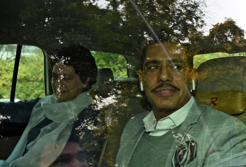 Priyanka Gandhi Vadra (L), a leader of India's main opposition Congress party, and her husband Robert Vadra are pictured outside the Enforcement Directorate (ED), a government agency that fights financial crime, in New Delhi, India, on Wednesday. — Reuters