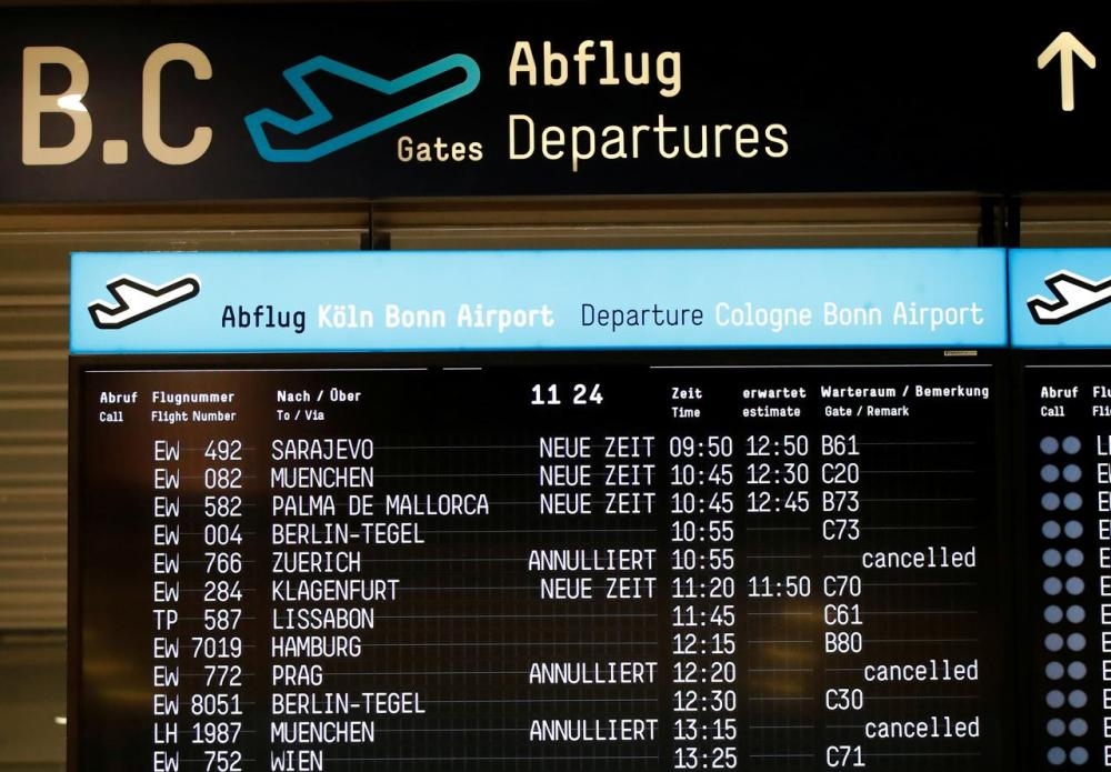 A departure board at Cologne-Bonn airport announces delays due to bad weather conditions in Cologne, Germany, in this file photo. — Reuters