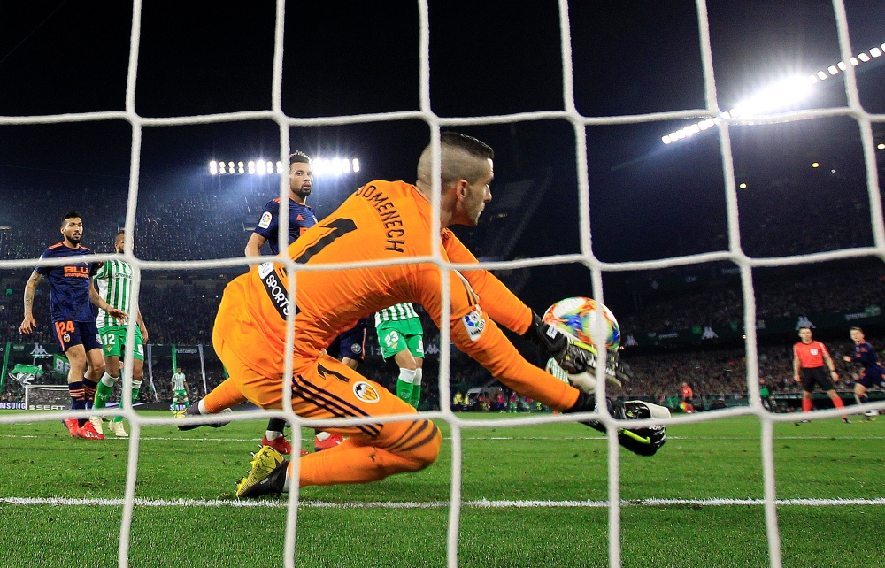 Valencia's Jaume Domenech concedes Real Betis' second goal scored by Joaquin from a corner kick during the Copa del Rey  semifinal first leg at the Estadio Benito Villamarin, Seville, on Thursday. — Reuters 