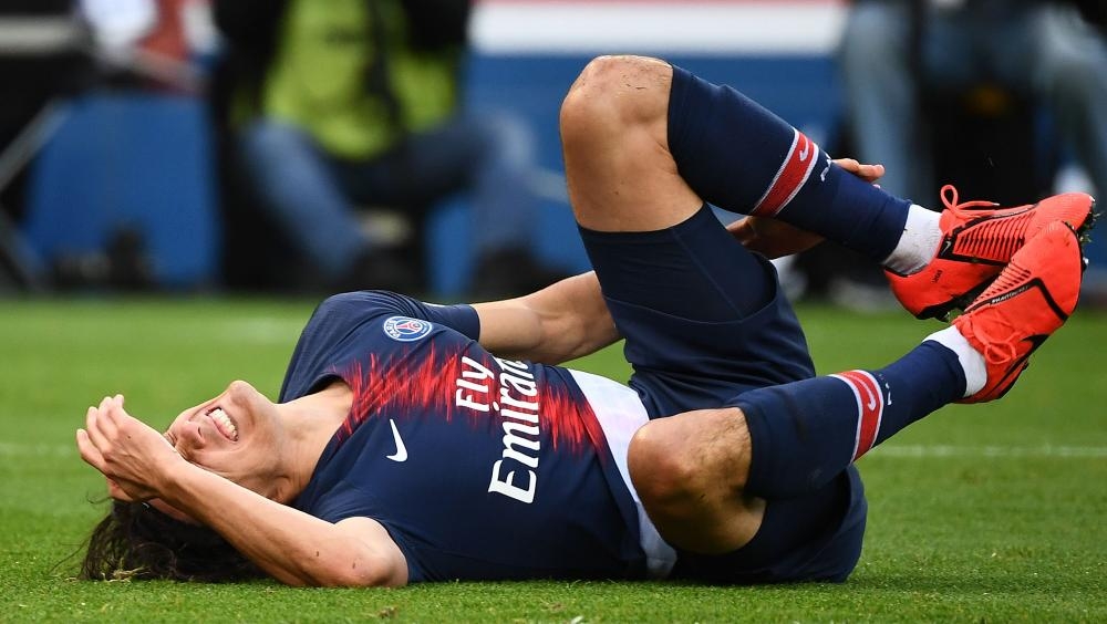 Paris Saint-Germain's Edinson Cavani gestures on the pitch due to an injury during the French L1 football match against FC Girondins de Bordeaux at the Parc des Princes Stadium in Paris Saturday. — AFP 