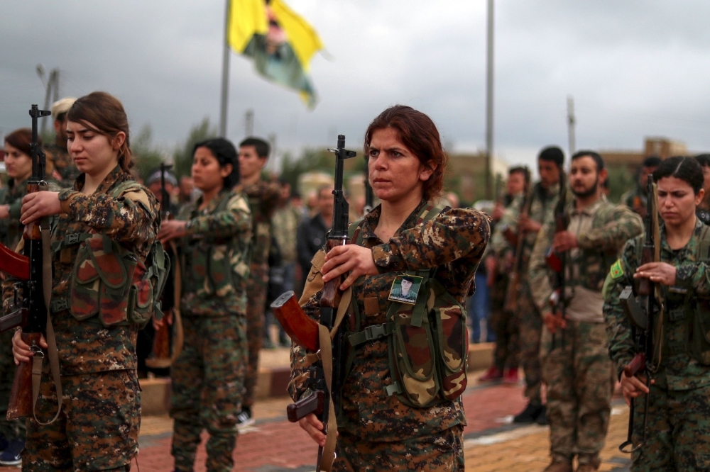 Fighters from the Kurdish women's protection units (YPJ) attend the funeral of a fellow fighter, who was killed while fighting against Daesh (the so-called IS) in northeastern Syrian Kurdish-majority city of Qamishli on Saturday. — AFP.  