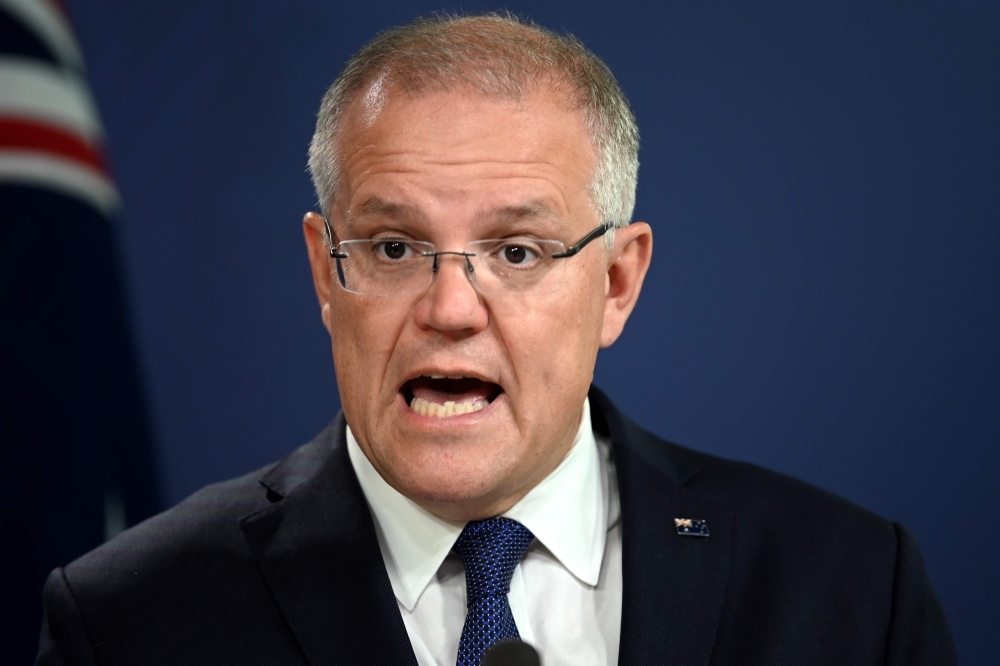 Australia’s Prime Minister Scott Morrison briefs media about the flooding situation in Queensland during a press conference in Sydney in this Feb. 8, 2019 file photo. — AFP