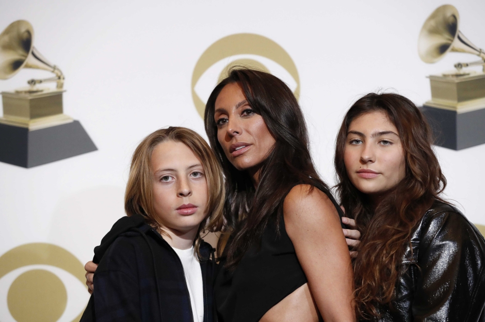 Chris Cornell's widow Vicky Cornell, daughter Toni, 14, and son Christopher, 13, pose after accepting his posthumous for Best Rock Performance award for 