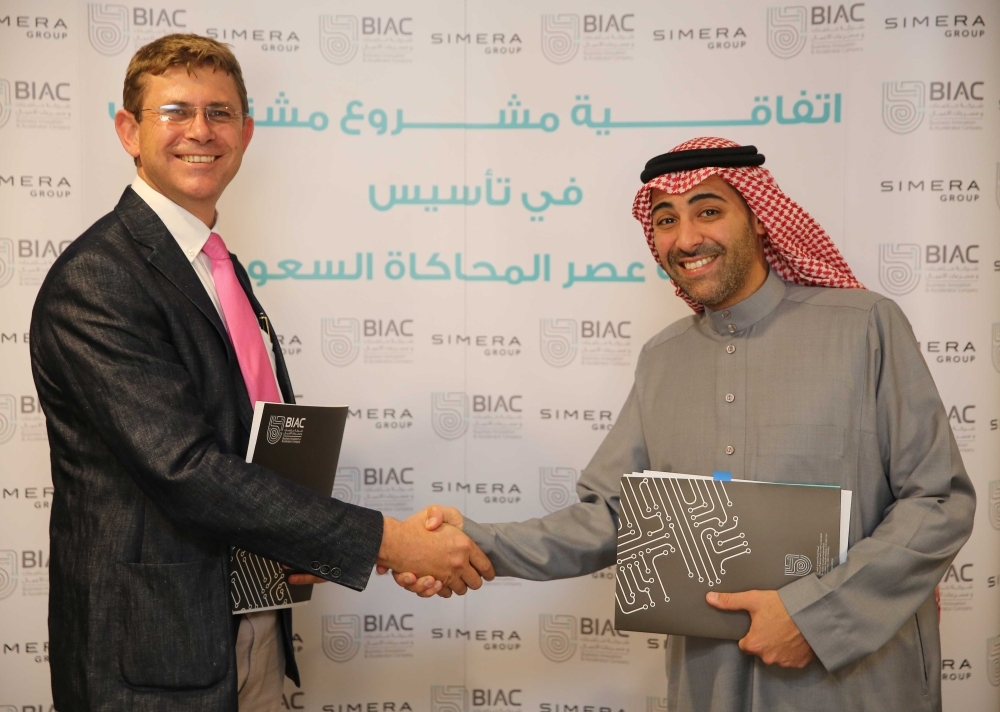 Nawaf Alsahaf, Chief Executive Officer of BIAC (right) and Johann du Toit, Chief Executive Officer of Simera Innovate, shake hands following the signing ceremony in Riyadh