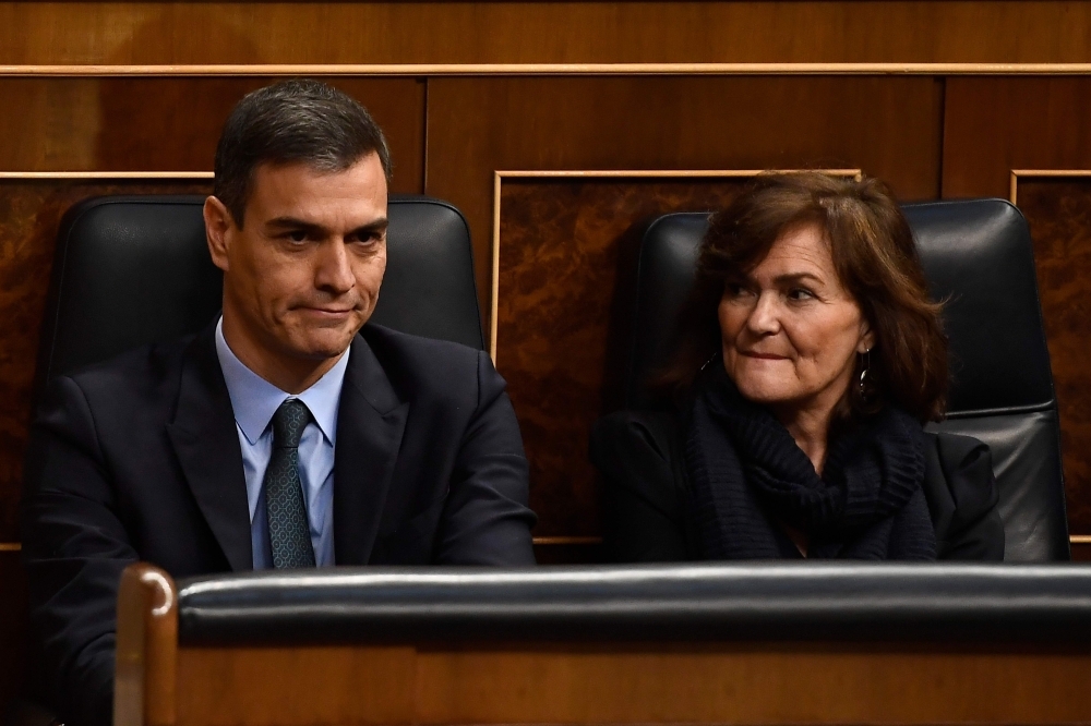 Spanish Prime Minister Pedro Sanchez, left, and Deputy Prime Minister Carmen Calvo attend a debate on the government’s 2019 budget during a parliament session in Madrid on Wednesday. — AFP