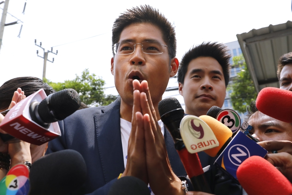 Thai Raksa Chart party leader Preechaphol Pongpanit makes the traditional Thai gesture of respect while speaking to journalists on arrival at the party headquarters in Bangkok in this Feb. 12, 2019 file photo. — AFP