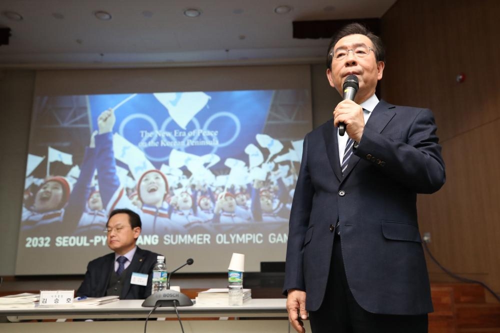This picture shows Seoul mayor Park Won-soon (R) speaking during a meeting held by South Korea's Olympic committee to choose a city for its bid for the 2032 Summer Olympics at the National Training Center in Jincheon. South Korea has picked its capital Seoul for its bid for the 2032 summer Olympics, which it aims to jointly host with North Korea. — AFP
