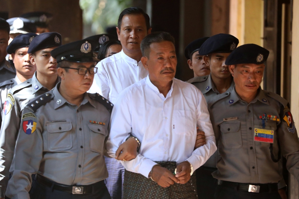 Kyi Lin and Aung Win Zaw, who are accused of the murder of Muslim lawyer Ko Ni, arrive at Insein court in Yangon, Myanmar, on Friday. — Reuters