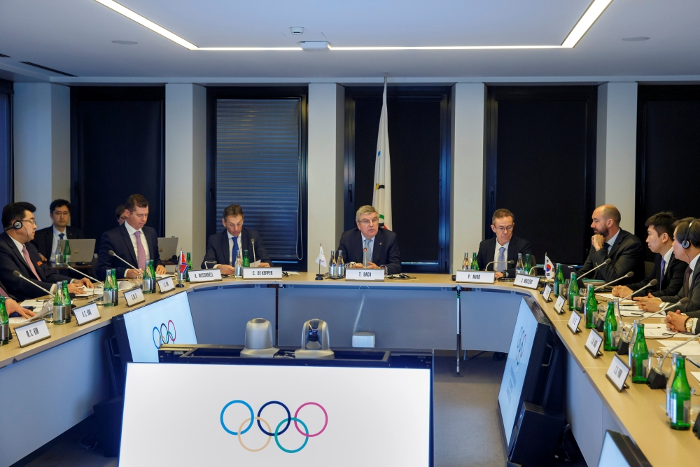 North Korea's Olympic Committee President and Minister of Physical Culture and Sports Kim Il Guk, and South Korean Sports Minister Do Jong-hwan speak prior a meeting with the IOC for their bid to co-host the 2032 Summer Olympics, at the IOC Headquarters in Lausanne, Switzerland, Friday. — Reuters