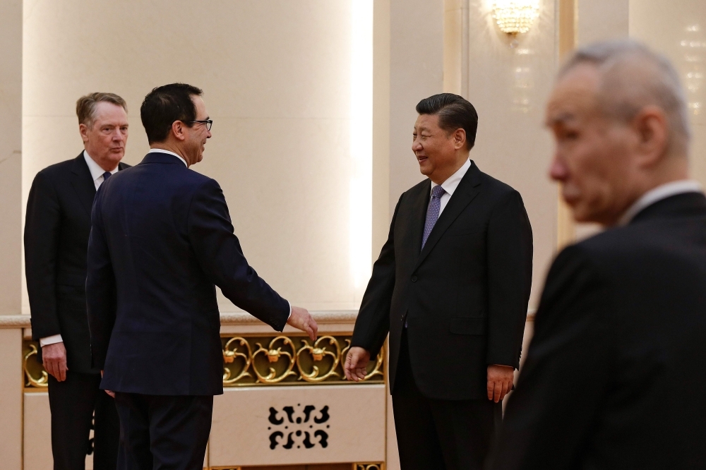 US Treasury Secretary Steven Mnuchin (2nd L) talks with Chinese President Xi Jinping as US Trade Representative Robert Lighthizer (L) and Chinese Vice Premier Liu He (R) look on before their meeting at the Great Hall of the People in Beijing on Friday. — AFP