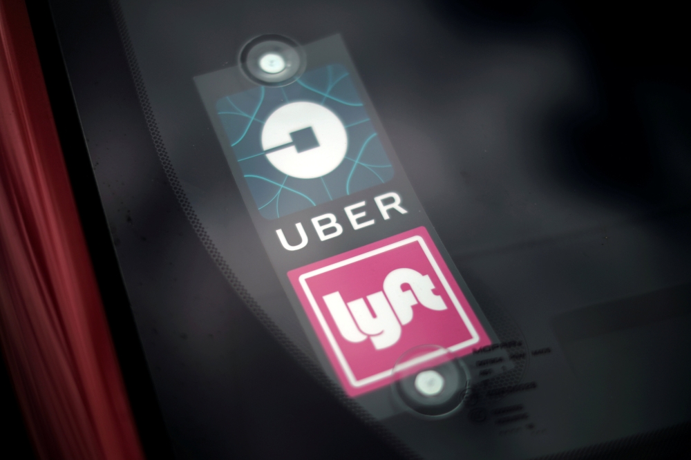 An Uber and Lyft car is seen in San Diego, California, US, in this file photo. — Reuters