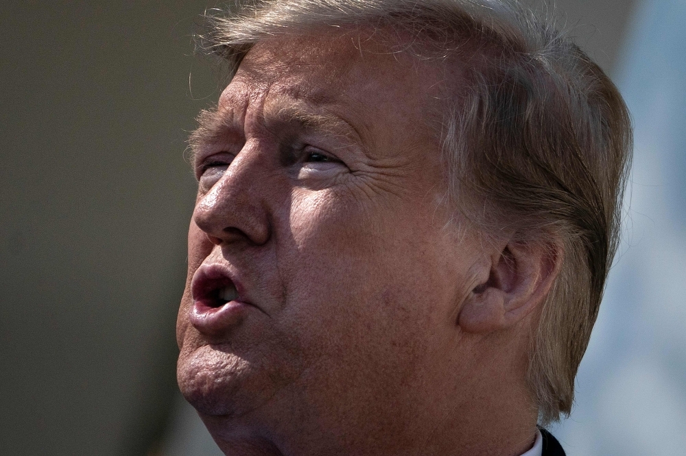 US President Donald Trump speaks about a state of emergency from the Rose Garden of the White House  in Washington on Friday. — AFP