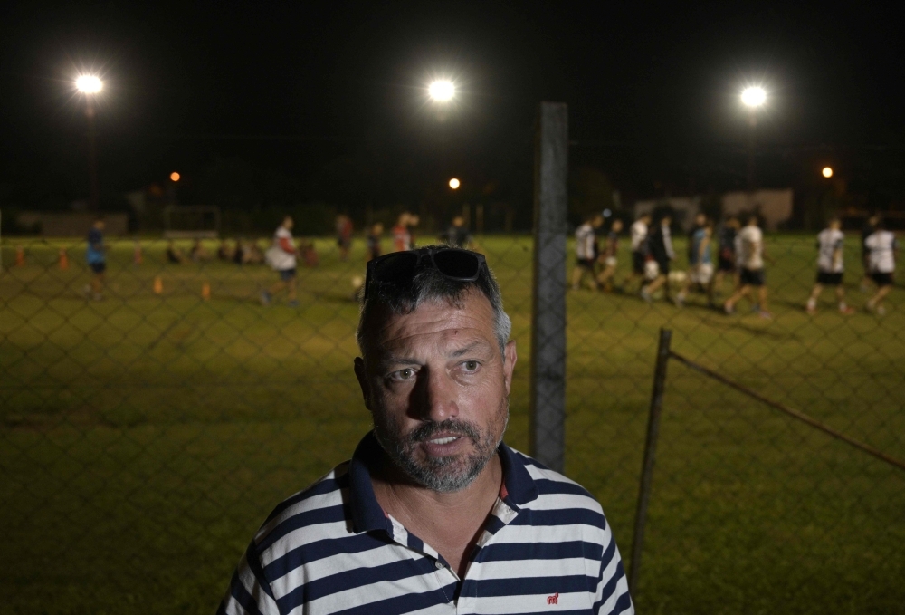 The president of Argentinian Club Atletico y Social San Martin, Daniel Ribero, gestures at the team's training pitch in Progreso, Santa Fe province, Argentina, where the wake of late Argentine footballer Emiliano Sala took place.  Argentine footballer Emiliano Sala's body is to be returned to Argentina on Friday. Sala's body was recovered from plane wreckage in the English Channel last week. He was flying to his new team, English Premier League side Cardiff City, from his old French club Nantes when his plane went missing over the Channel on Jan. 21. — AFP