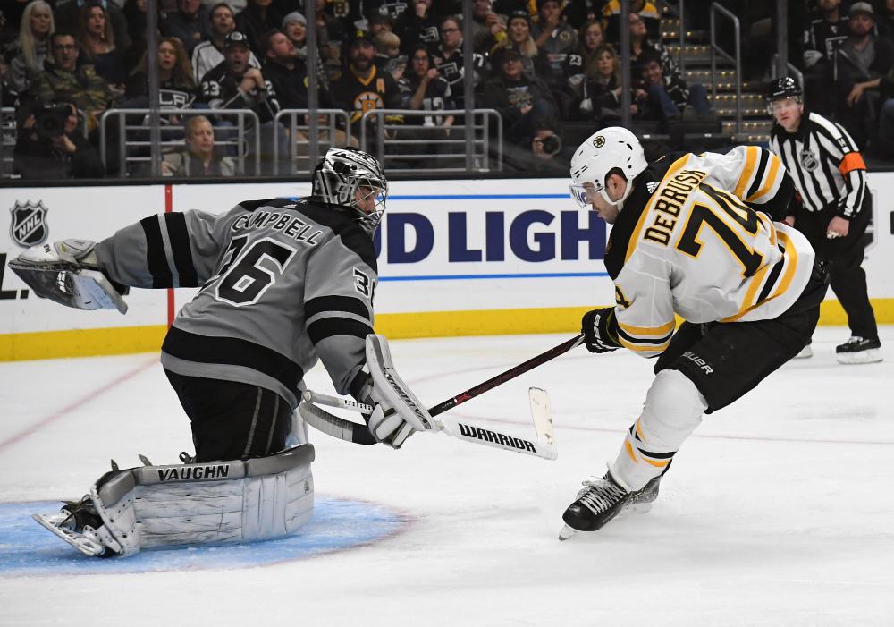 Los Angeles Kings’ goaltender Jack Campbell blocks a shot from Boston Bruins’ Jake DeBrusk during their NHL game at Staples Center in Los Angeles Saturday. — Reuters