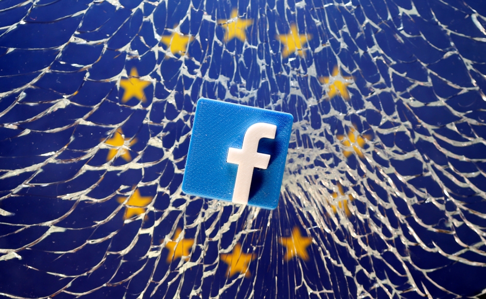 A 3D printed Facebook logo is placed on broken glass above a printed EU flag in this illustration taken on Jan. 28, 2019 file photo. — Reuters