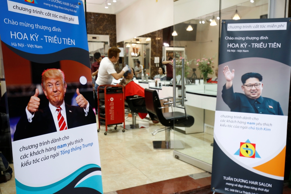 A barbershop offers free haircuts in the style of North Korean leader Kim Jong Un and US President Donald Trump in Hanoi, Vietnam, on Tuesday. — Reuters