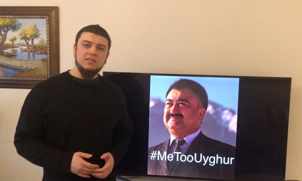 This handout frame grab made from video taken on February 11, 2019 and released by Arslan Hidayat shows Hidayat, the son-in-law of Uighur comedian Adil Mijit (R), calling for a 