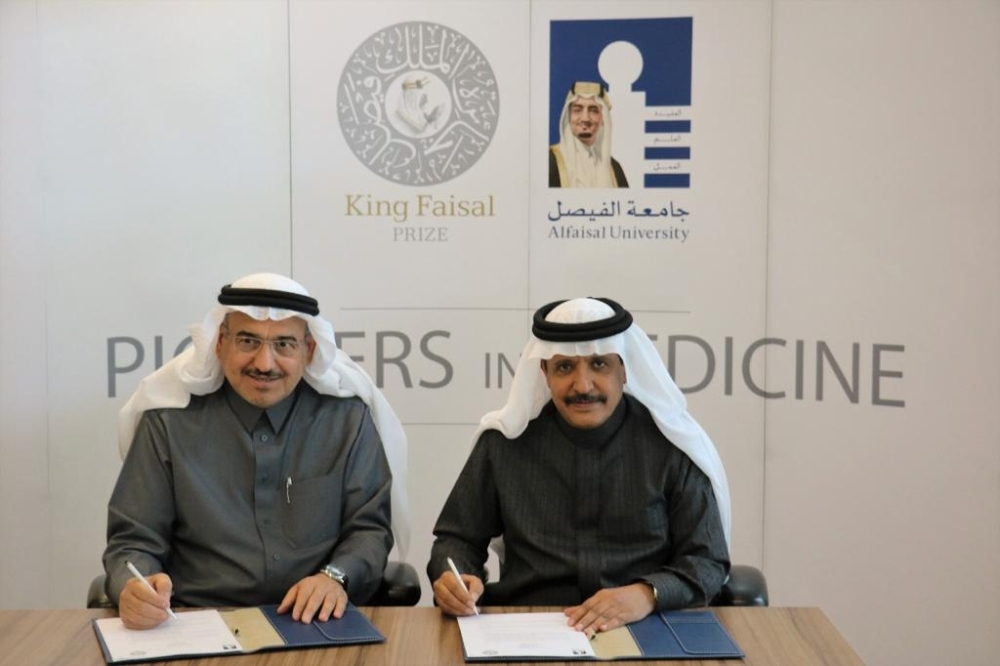 


Dr. Mohammed Al-Hayaza, president of Alfaisal University, and Dr. Abdulaziz Alsebail, secretary-general of King Faisal Prize, sign the agreement.