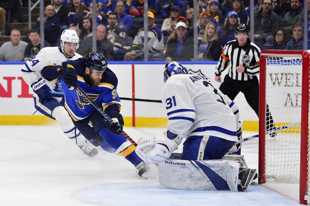 St. Louis Blues’ center Ryan O’Reilly (2nd L) shoots against Toronto Maple Leafs’ goaltender Frederik Andersen during their NHL game at Enterprise Center in St. Louis Tuesday. — Reuters 