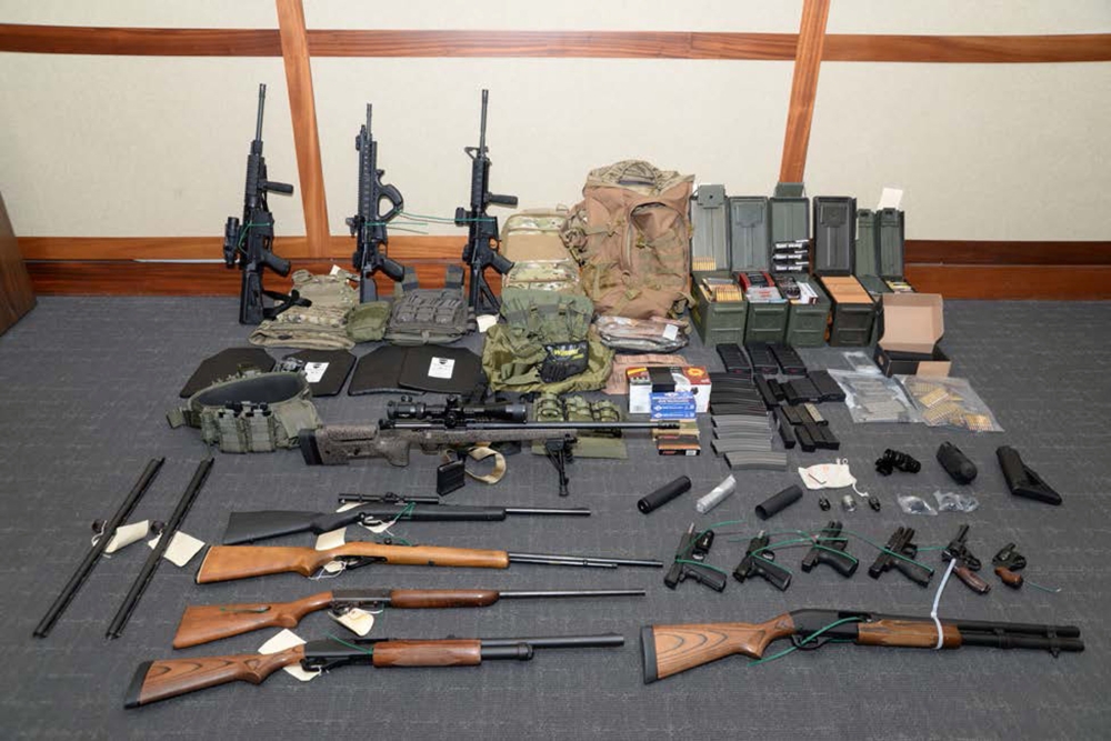 A cache of guns and ammunition uncovered by US federal investigators in the home of US Coast Guard lieutenant Christopher Paul Hasson in Silver Spring, Maryland, is shown in the photo provided on Wednesday. — Reuters