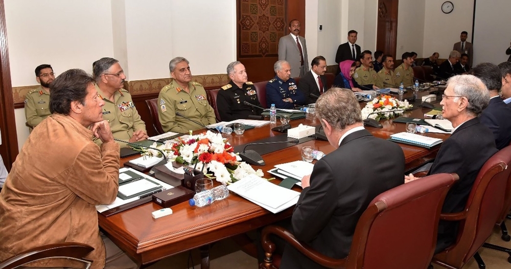 Pakistan Prime Minister Imran Khan, left, leads a meeting of the National Security Committee in Islamabad following the ongoing tensions between Pakistan and India on Thursday. — AFP