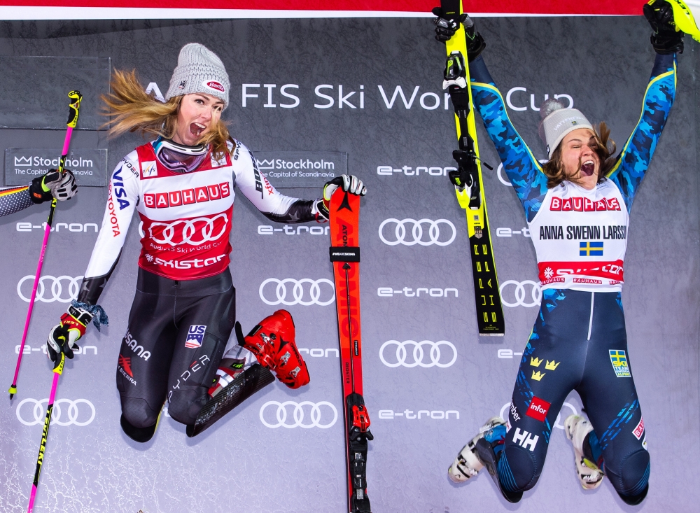 Mikaela Shiffrin of USA and Anna Swenn-Larsson of Sweden celebrate on the podium after the FIS alpine world cup city event on Tuesday in Stockholm. — Reuters
