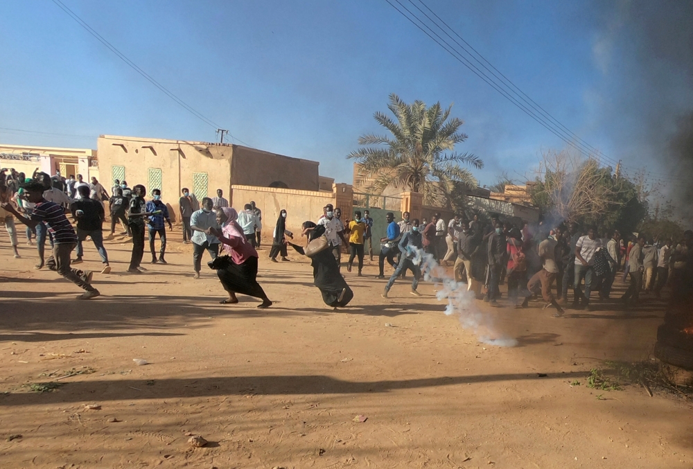Sudanese demonstrators run from a teargas canister fired by riot policemen to disperse them as they participate in anti-government protests in Omdurman, Khartoum, Sudan, in this Jan. 20, 2019 file photo. — Reuters