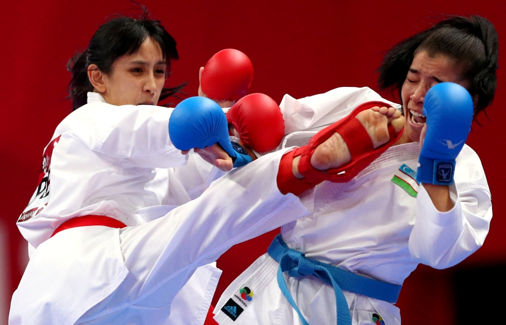 Karate bout between Bakhriniso Babaeva of Uzbekistan and Gu Shiaushaung of Taiwan at JCC Plenary Hall, Jakarta, Indonesia,in this file photo. — Reuters