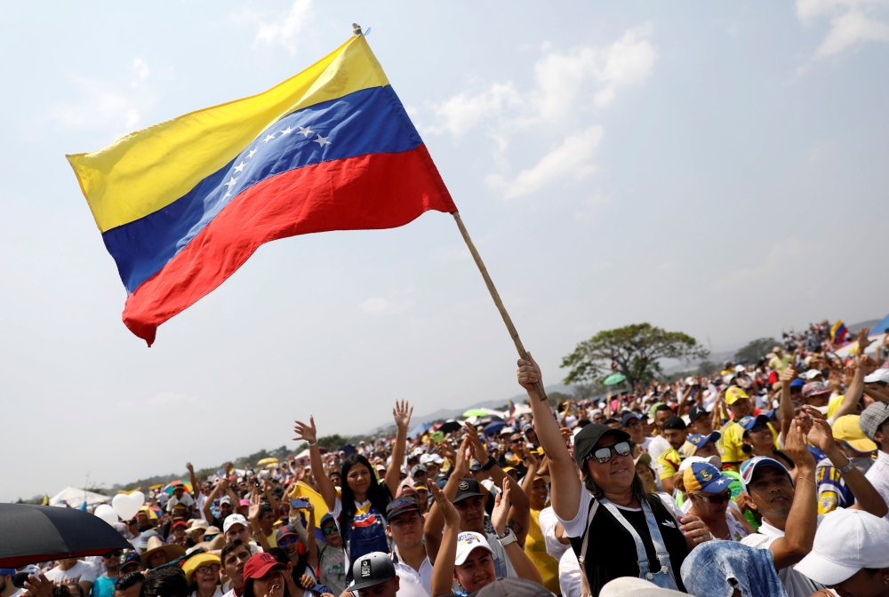 People attend the “Venezuela Aid Live” concert at the Tienditas cross-border bridge between Colombia and Venezuela, in Cucuta, Colombia, on Friday. — Reuters