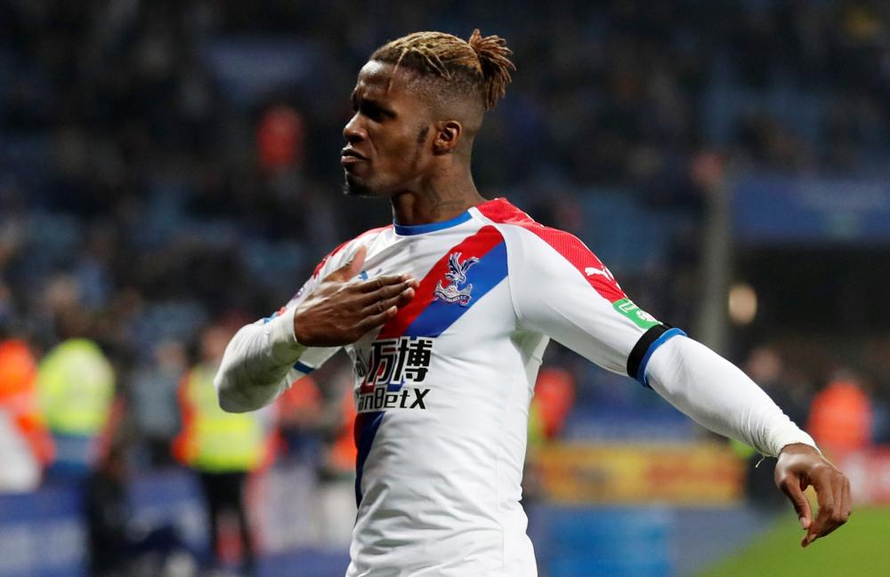 Crystal Palace’s Wilfried Zaha celebrates scoring their fourth goal against Leicester during their Premier League match at King Power Stadium in Leicester Saturday. — Reuters