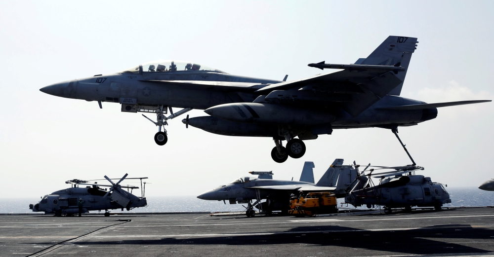 A US Navy F18 fighter jet lands on the deck of aircraft carrier USS Carl Vinson  during a routine exercise in South China Sea, in this March 3, 2017 file photo. — Reuters