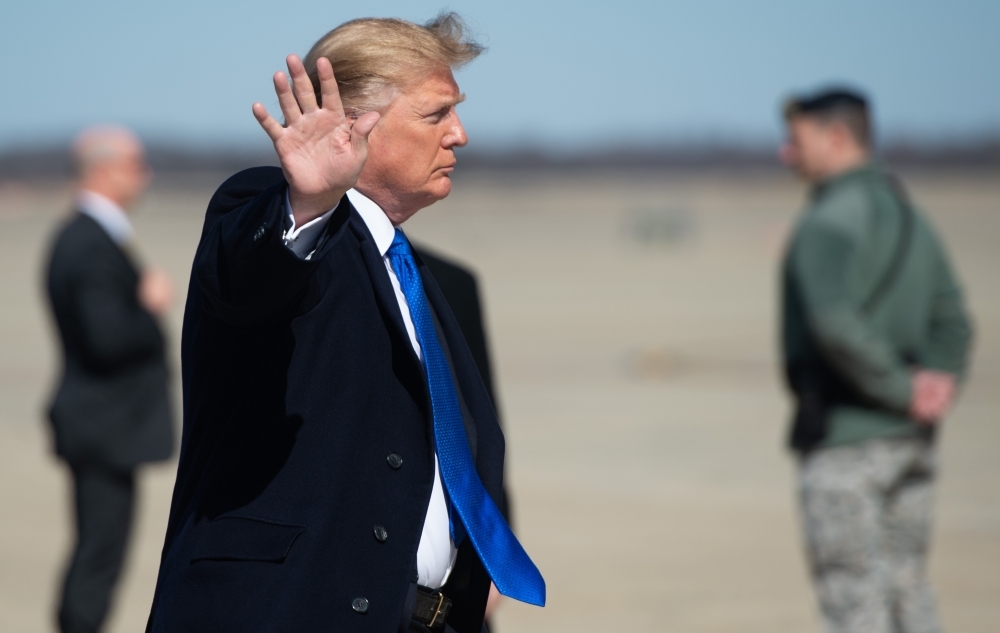 US President Donald Trump boards Air Force One prior to departure from Joint Base Andrews in Maryland on Monday, as he travels to Hanoi, Vietnam for a second summit with North Korean leader Kim Jong Un. — AFP
