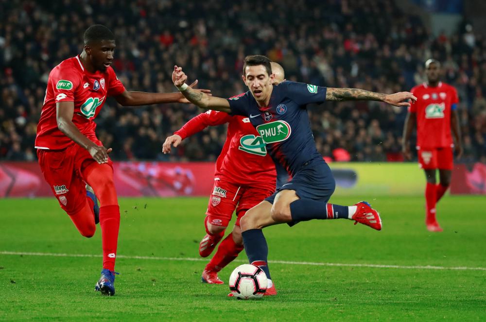 Paris St Germain’s Angel Di Maria in action against Dijon during their French league match at Parc des Princes, Paris Tuesday. — Reuters