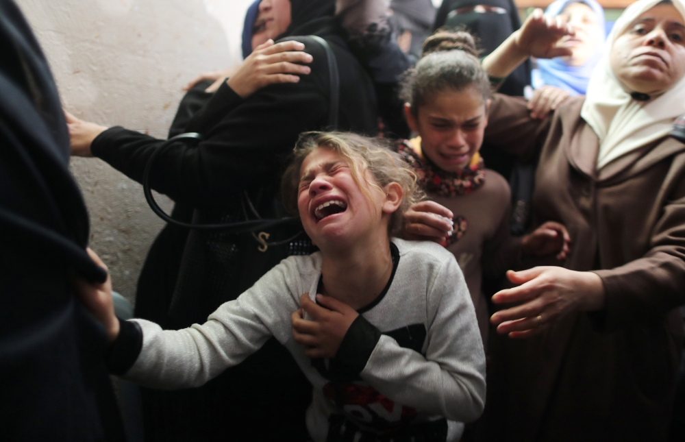 A relative of Palestinian teenager Yousif Al-Dayyah, 15, who was killed at the Israel-Gaza border fence during a protest on Friday, mourns during his funeral in Gaza City in this Feb. 23, 2019 file photo. — Reuters