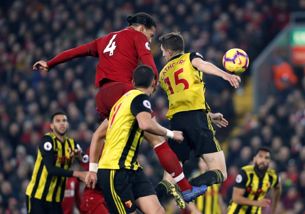 Liverpool's Virgil van Dijk scores their fifth goal against Watford during the English Premier League encounter at Anfield, Liverpool, Britain, on Wednesday. — Reuters