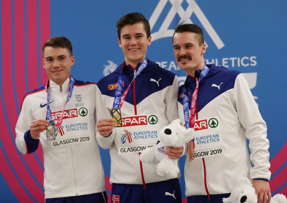 Norway’s Jakob Ingerbrigtsen (C) celebrates winning the gold medal in the 3,000m with silver medal winner Great Britain’s Chris O’Hare (L) and bronze medal winner Norway’s Henrik Ingerbrigtsen at the 2019 European Indoor Athletics Championships in Emirates Arena, Glasgow, Saturday. — Reuters 