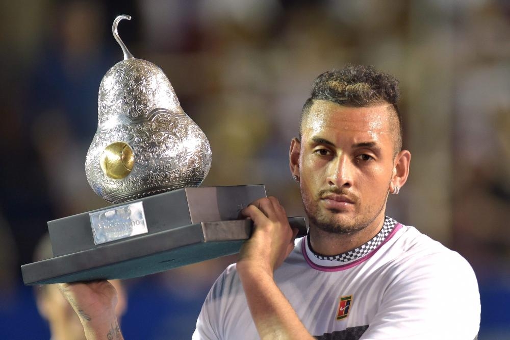 Nick Kyrgios of Australia holds the trophy after defeating Alexander Zverev of Germany in the Mexico ATP Open final in Acapulco Saturday. — AFP 