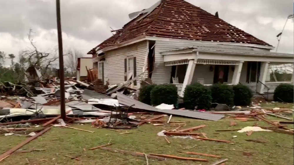 Debris and a damaged house seen following a tornado in Beauregard, Alabama, US in this Sunday still image obtained from social media video. — Reuters