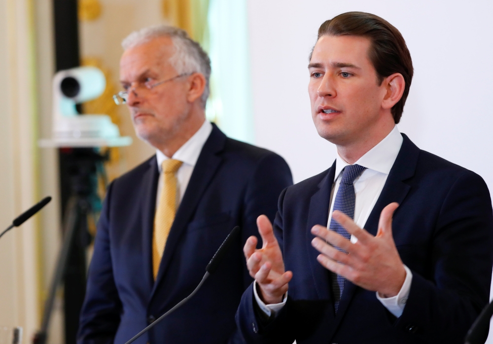 Austria’s Chancellor Sebastian Kurz, right, and Justice Minister Josef Moser address the media in Vienna, Austria, on Wednesday. — Reuters