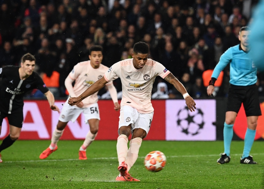 Manchester United's English forward Marcus Rashford scores a penalty during the UEFA Champions League round of 16 second-leg football match between Paris Saint-Germain (PSG) and Manchester United at the Parc des Princes stadium in Paris on Wednesday. — AFP