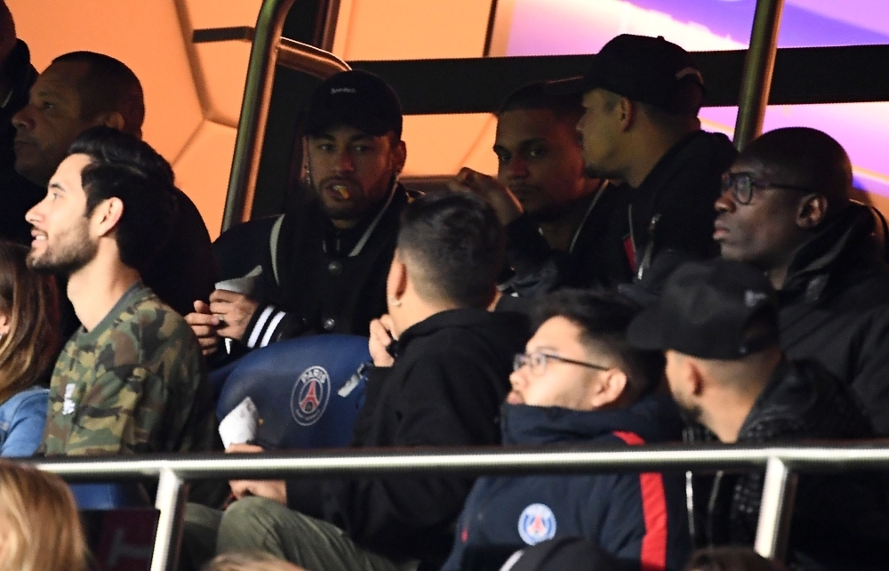 Paris Saint-Germain's Brazilian forward Neymar (C_L) looks on during the UEFA Champions League round of 16 second-leg football match between Paris Saint-Germain (PSG) and Manchester United at the Parc des Princes stadium in Paris on Wednesday. — AFP