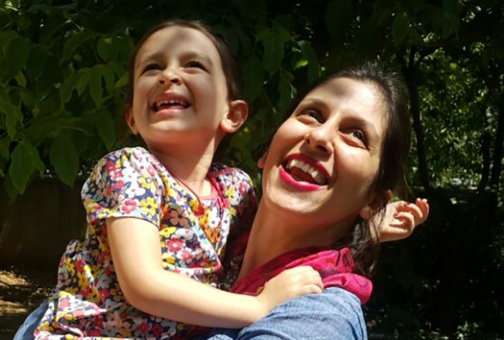 This file handout picture released by the Free Nazanin campaign on Aug. 23, 2018 shows Nazanin Zaghari-Ratcliffe, right, embracing her daughter Gabriella in Damavand, Iran, following her release from prison for three days. — AFP