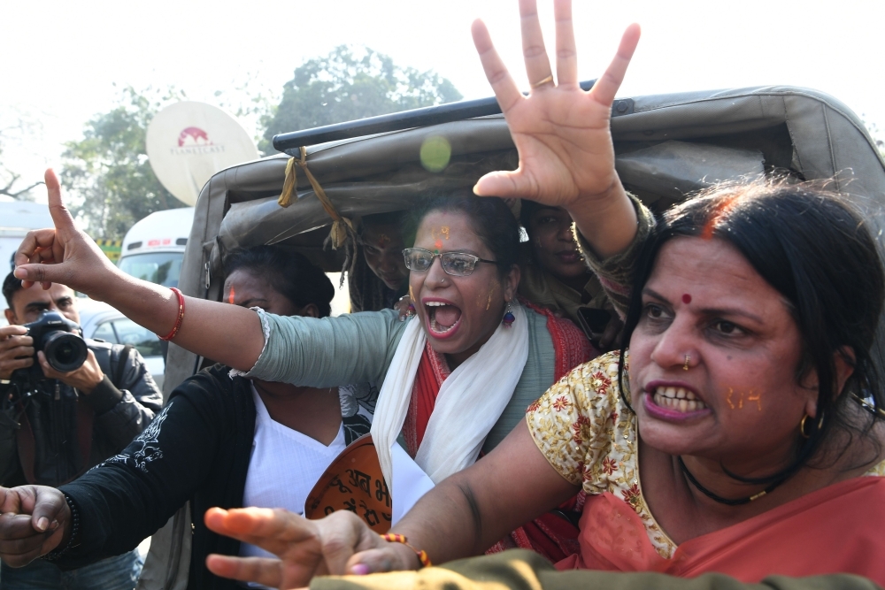 Indian Hindu protesters shout slogans from a police vehicle outside the Indian Supreme Court in New Delhi after the hearing in the Ayodhya temple dispute case was further delayed in this Jan. 10, 2019 file photo. — AFP