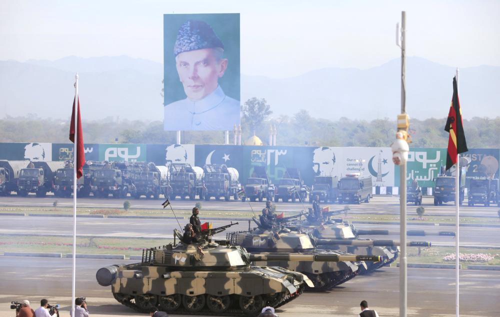 


Photos from the archives show Pakistani armed forces in tanks take part during the Pakistan Day military parade in Islamabad. (Left) Commandos from the Special Services Group (SSG) march during the military parade. — Reuters