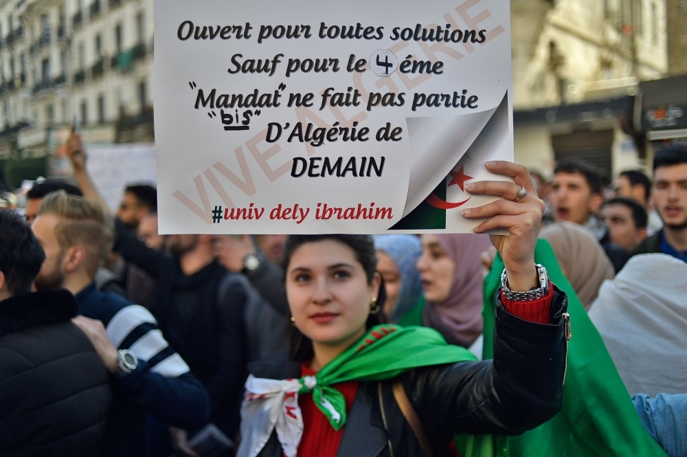 Algerian students demonstrate in the center of the capital Algiers on Tuesday, one day after President Abdelaziz Bouteflika announced his withdrawal from a bid to win another term in office and postponed an April 18 election, following weeks of protests against his candidacy. — AFP
