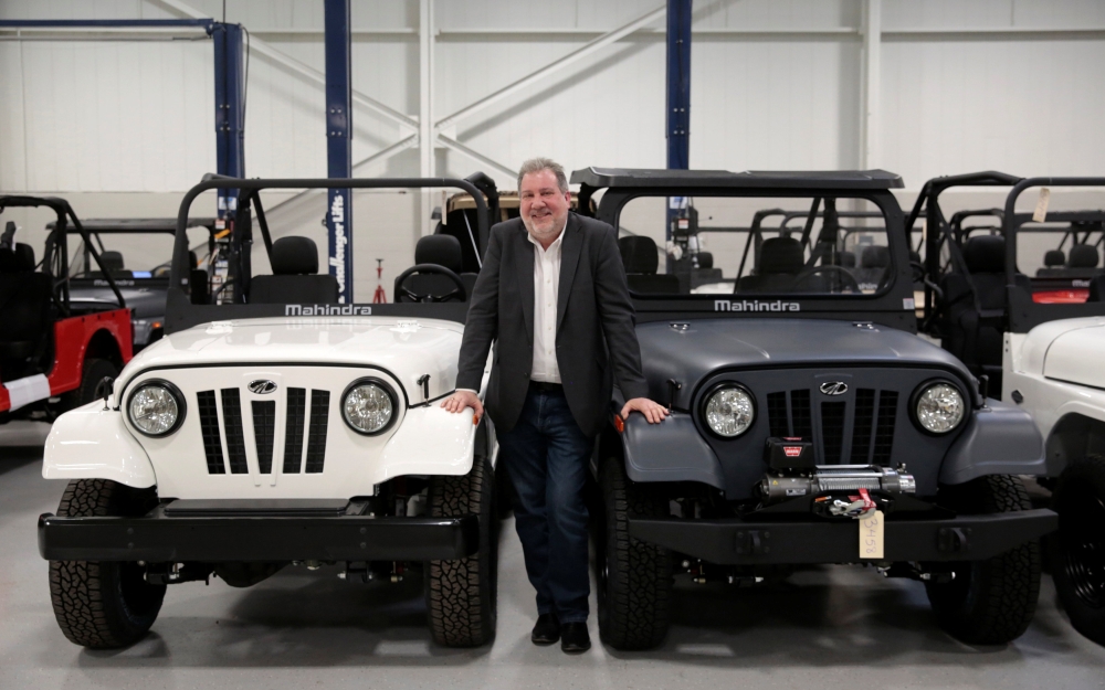 Mahindra Automotive North America President and CEO Rick Haas poses next to Roxor off-road vehicles in the MANA assembly plant in Auburn Hills, Michigan, US. — Reuters