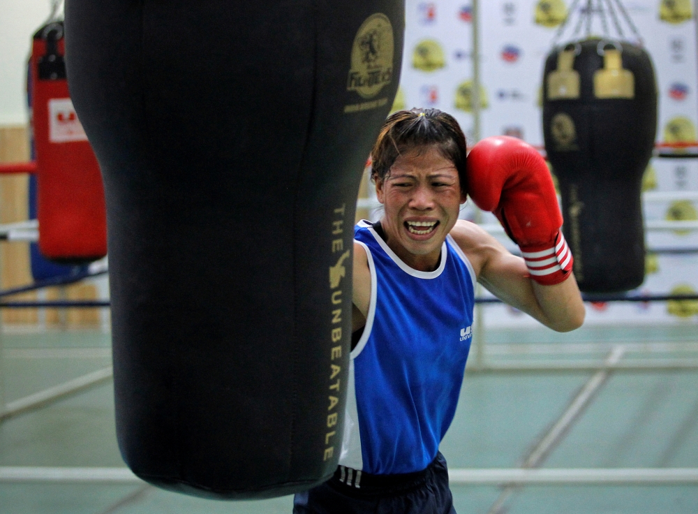 India's boxer MC Mary Kom punches a bag during a training session at Balewadi Stadium in Pune, about 190 km (118 miles) from Mumbai, in this file photo. — Reuters