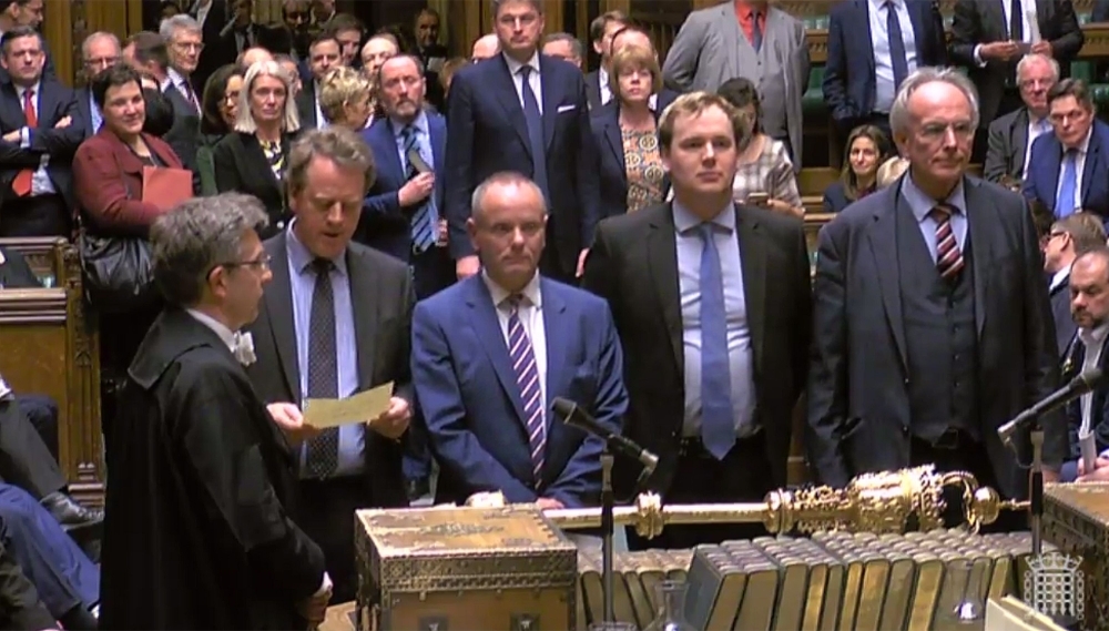 A video grab from footage broadcast by the UK Parliament's Parliamentary Recording Unit (PRU) shows the tellers (L-R) Conservative MP Alister Jack, Conservative MP Mike Freer, Conservative MP William Wragg and Conservative MP Peter Bone delivering the result of vote on a government motion on whether to seek a delay in the date of leaving the EU, in the House of Commons in London on Thursday. — AFP
