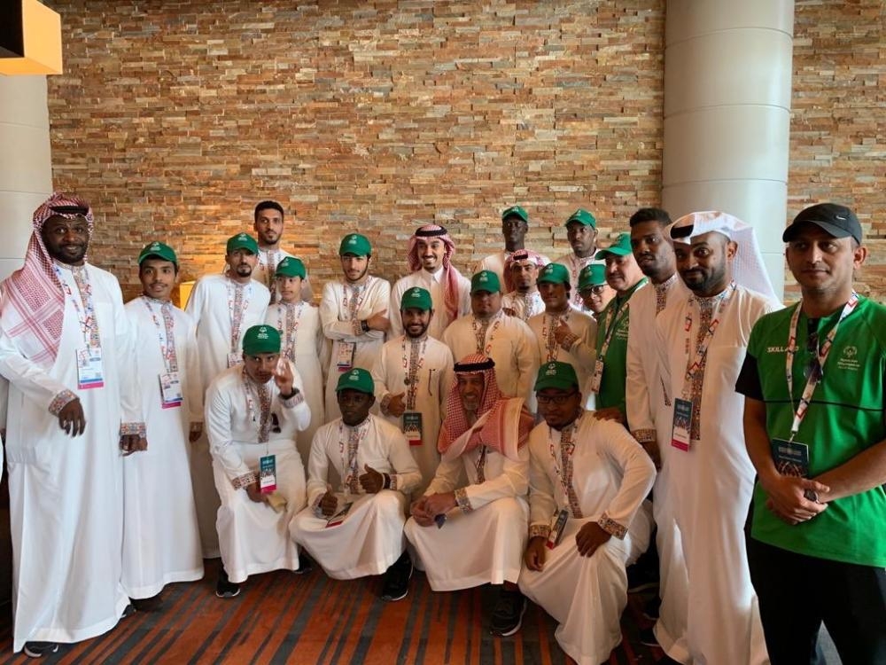 Prince Abdul Aziz Bin Turki Al-Faisal, chairman of the board of directors of the General Authority of Sports, poses for a photo with the Saudi team members taking part in the Special Olympics World Games in Abu Dhabi on Thursday. — SPA